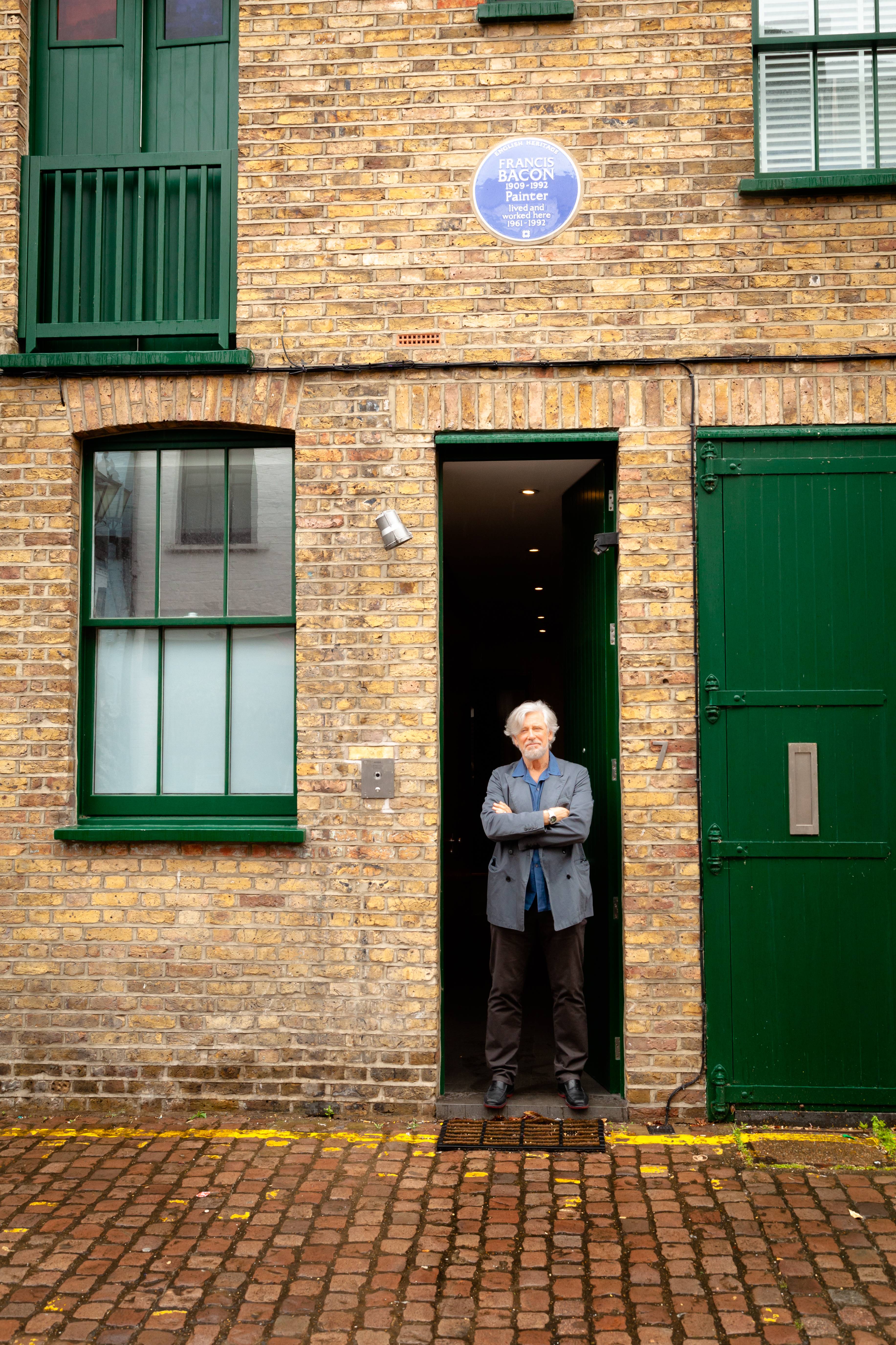 Adam Clayton in front of Francis Bacon’s 7 Reece Mews studio. Photo © Mount Venus Productions