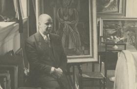 Roy de Maistre in his studio at 13 Eccleston Street, showing the back of the Francis Bacon sofa, c.1944 